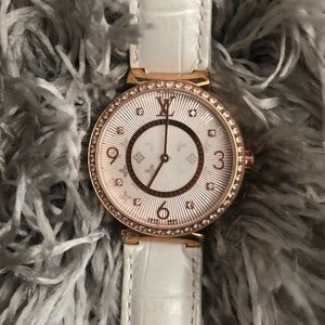 Tambour Monogram Louis Vuitton watch.